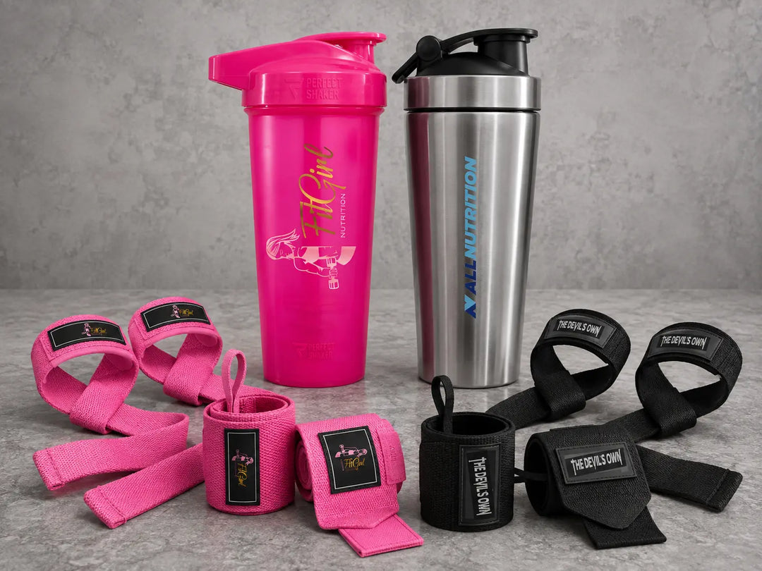 FitGirl and ALLNUTRITION shakers with pink FitGirl and black The Devil’s Own wrist wraps and lifting straps